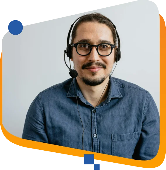 Call center agent with headset assisting customers via email customer support in a professional environment